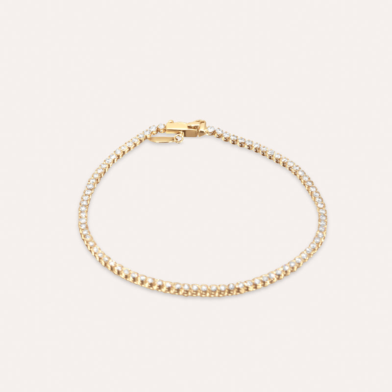 Diamond and gold tennis bracelet