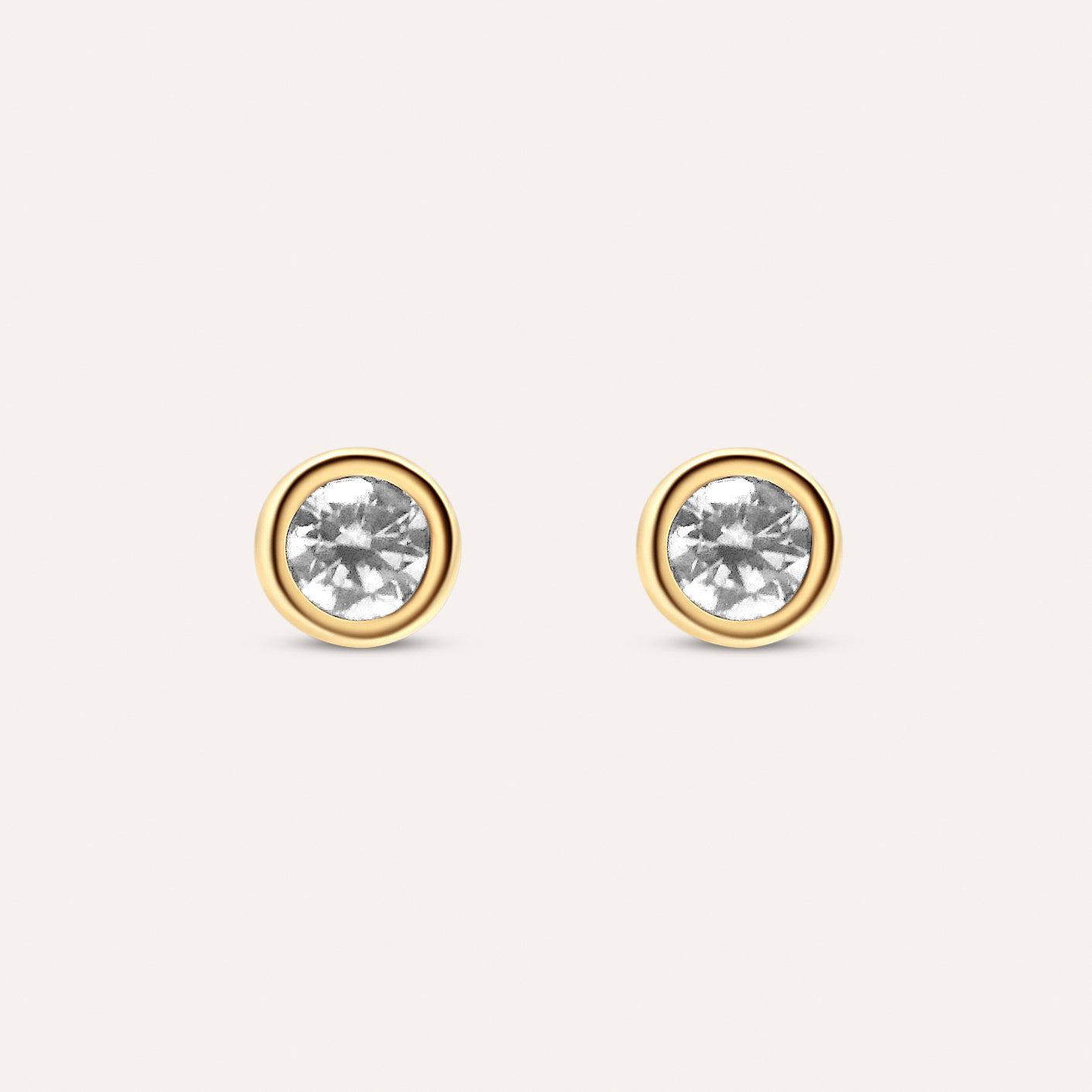 Diamond and gold solitaire studs